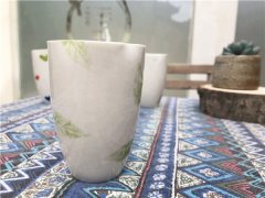 手工陶艺店陶瓷作品纯色绿叶花瓣杯